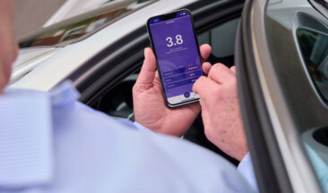 Driver checking phone app