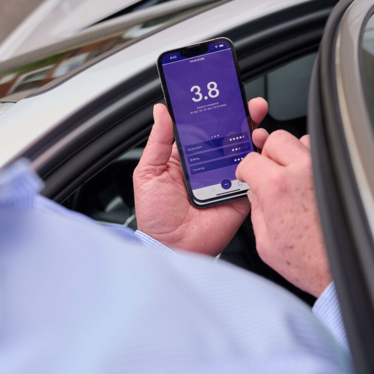 Driver checking phone app