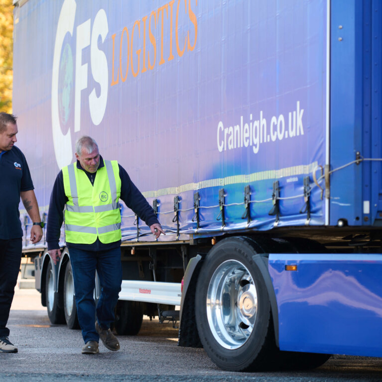 Driver checking truck