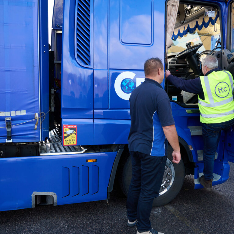 Driver checking truck