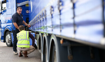 Driver checking truck