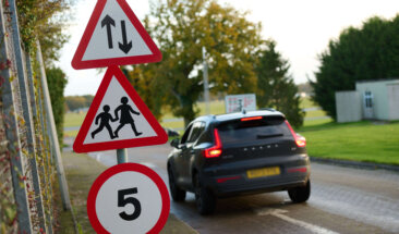 Car driving past signs