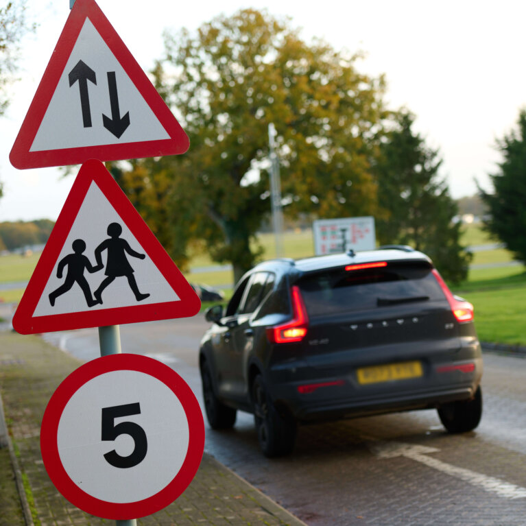 Car driving past signs