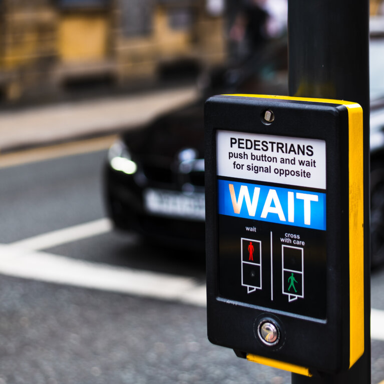 Pedestrian crossing WAIT sign
