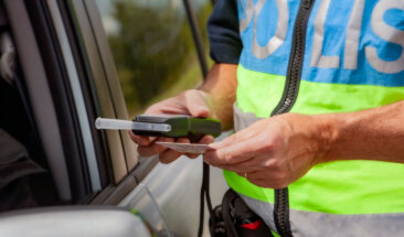 Policeman Holding Device For Checking Alcohol Intoxication