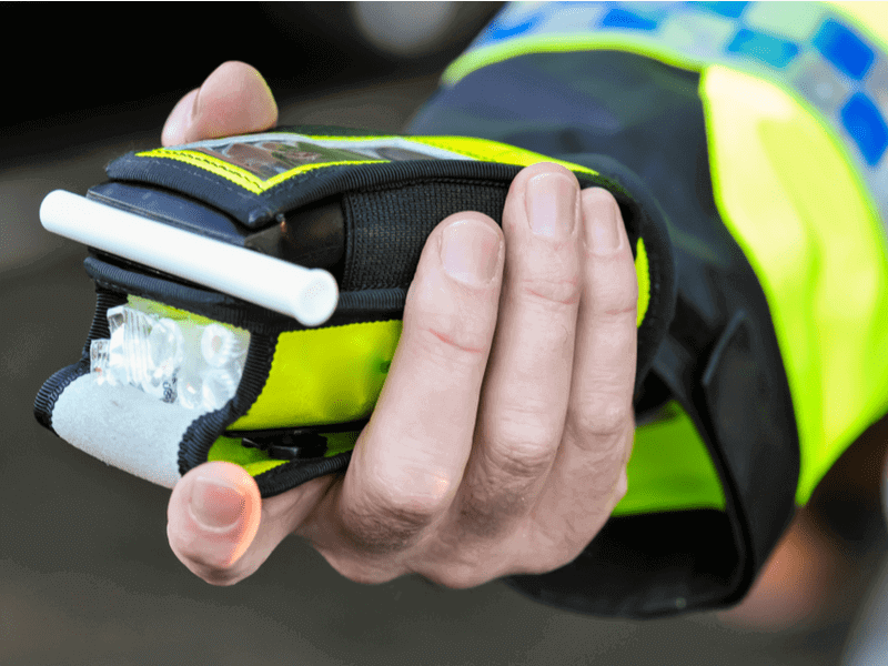 Breathtest machine in police officer's hand